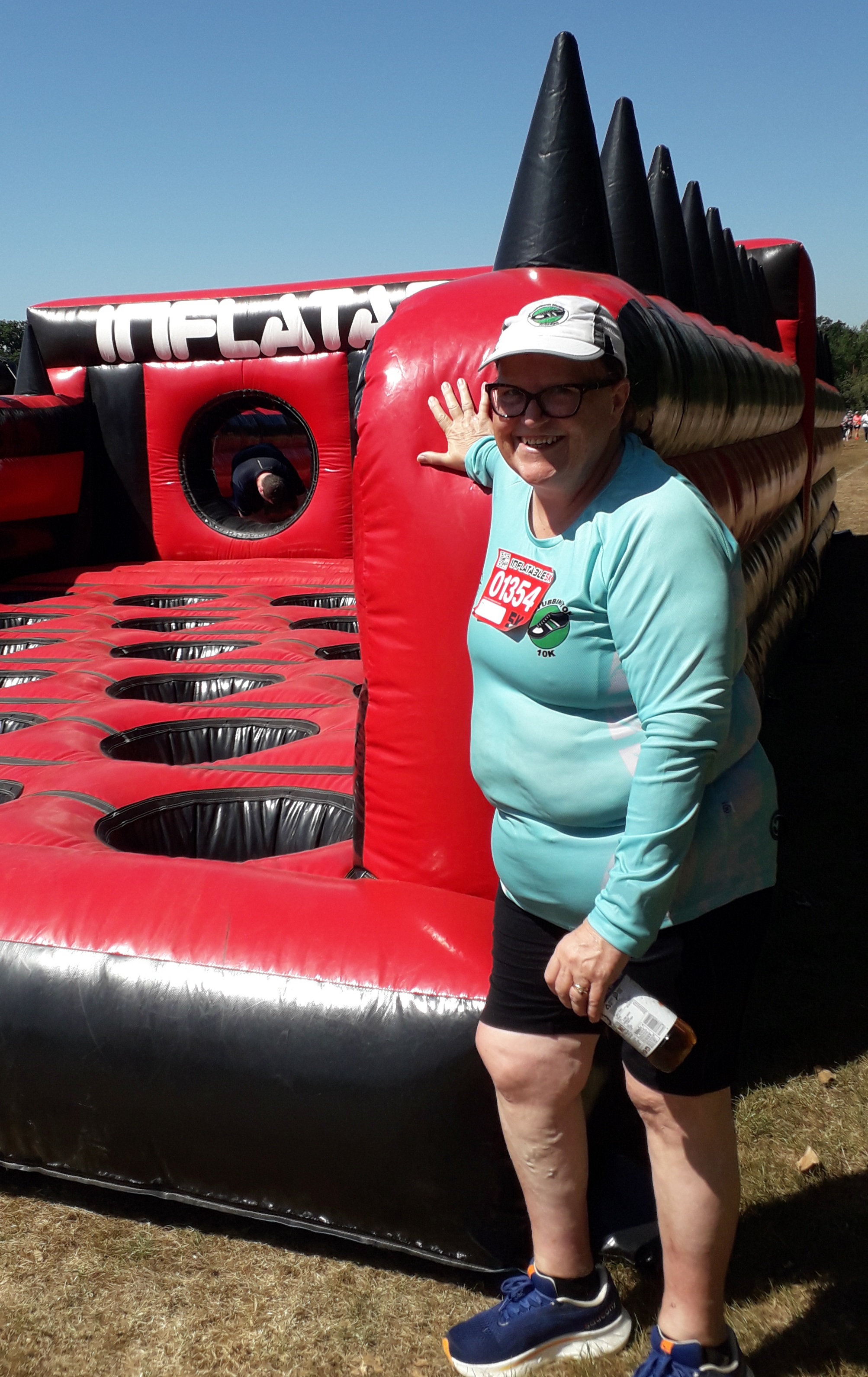 Sue Morgan stands by an inflatable challenge